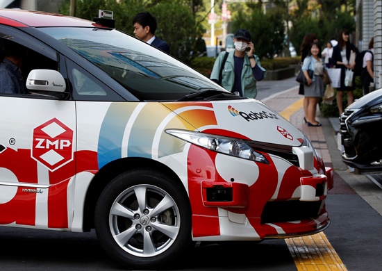 ZMP Incs RoboCar MiniVan, a self-driving Toyota Estima Hybrid car, is seen after a joint news conference between ZMP and Hinomaru Kotsu Co in Tokyo, Japan June 15, 2017. REUTERS/Toru Hanai