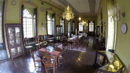 This Friday June 2, 2017 photo shows the dining room of the the sprawling Figueiredo Mansion, a 427-year-old Portuguese heritage home in Goa, India. The home is a much-loved and lived-in repository of memories tracing to when what is now the west-coast Indian state of Goa was a Portuguese colony. Far from the party beaches and liquor shacks that Goa has become known for, the mansion is now open as both a homestay and a museum, filled with antique furniture and artifacts from the 17th century. (AP Photo/Manish Mehta)