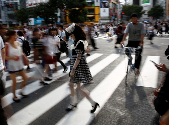 Doll model Lulu Hashimoto walks on crosswalk during a photo opportunity for Reuters in Tokyo, Japan August 23, 2017. Picture taken August 23, 2017. REUTERS/Kim Kyung-Hoon