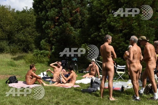 Naked people sit on the grass at a newly opened space for naturists at the Bois de Vincennes park in Paris on August 31, 2017. The space will be open daily until October 15th. Bertrand Guay/AFP