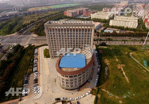 This photo taken on September 21, 2017 shows an aerial view of the buliding of the Career and Entrepreneurship Comprehensive Service Base of University Graduates in Zhengzhou in Chinas central Henan province. STR/AFP