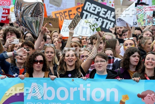 Protesters hold up placards as they take part in the March for Choice, calling for the legalising of abortion in Ireland after the referendum announcement, in Dublin on September 30, 2017. Tens of thousands are expected at a rally for abortion rights in Dublin on September 30, campaigning on one side of a fierce debate after Ireland announced it will hold a referendum on the issue next year. Paul Faith/AFP