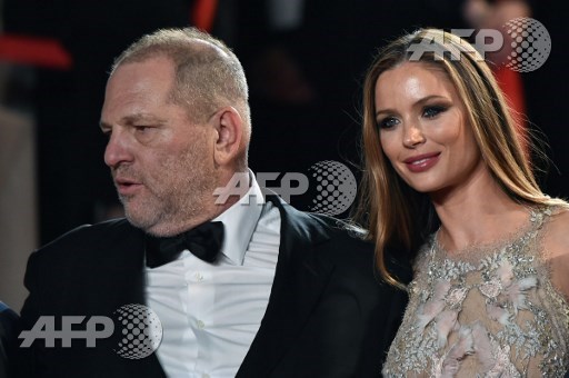 FILES) This file photo taken on May 16, 2016 shows US producer Harvey Weinstein and his wife British fashion designer and actress Georgina Chapman arriving for the screening of the film Hands of Stone at the 69th Cannes Film Festival in Cannes,France. Weinstein was fired from his film studio the Weinstein Company on October 8, 2017, following reports that he sexually harassed women over several decades, according to US media. Alberto Pizzoli/AFP