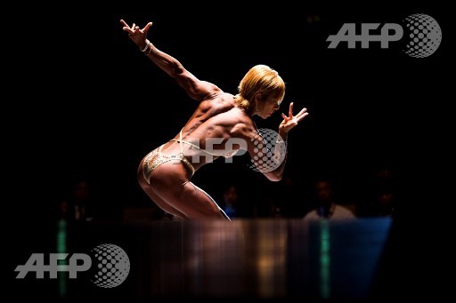 In this picture taken on October 9, 2017, Japanese bodybuilder Satoko Yamanouchi poses during the Japan bodybuilding championships in Tokyo. Behrouz Mehri/AFP