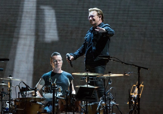 (FILES) This file photo taken on May 23, 2017 shows Larry Mullen Jr. and Bono(R) of U2 performing onstage on The Joshua Tree Tour at NRG Stadium in Houston Texas. Suzanne Cordeiro/AFP