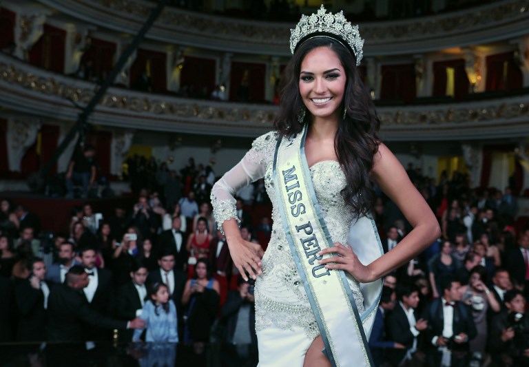 Handout picture released on October 31, 2017 by Latina Television showing the new Miss Peru 2017, Romina Lozano, on October 29, 2017, at the Municipal Theatre of Lima. Contestants turned the Miss Peru pageant into a protest highlighting violence against women, reciting a litany of facts about crimes against women and girls -Eighty-one percent of people who attack young girls are close to the family or my measurements are: 2,202 cases of feminicides reported in the last nine years in my country- instead of the traditional trite body measurements. Ho/Latina Television/AFP