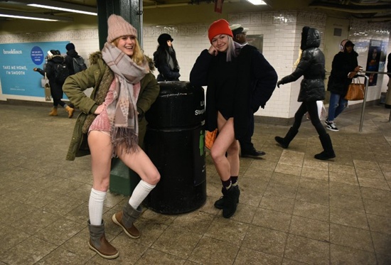 Participants in the 17th Annual No Pants Subway Ride travel through a New York City subway station on January 7, 2018 in New York. Timothy A. Clary/AFP