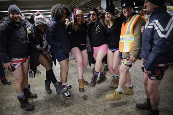 NEW YORK, NY: People in underwear pose for a picture after taking part in the No Pants Subway Ride braving freezing temperatures on January 7, 2018 in New York City. Eduardo Munoz Alvarez/Getty Images/AFP 