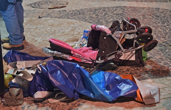 A discarded pram is seen at the scene of a car crash at Copacabana beach in Rio de Janeiro on January 18, 2018. At least 11 people were injured by a car that drove up onto Copacabanas tourist-packed seafront promenade in the heart of Rio de Janeiro. Carl de Souza/AFP