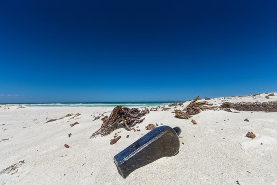 This undated photo received courtesy from Kym Illman on March 7, 2018 shows a bottle which contained an almost 132-year-old message, that was found near Wedge Island, some 160 kilometres (99 miles) north of Perth. Kym Illman/AFP
