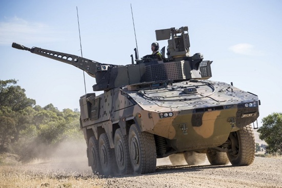 This handout from the Australian Department of Defence taken on February 22, 2017 shows a Rheinmetall Boxer CRV vehicle driving off from the armoured fighting vehicle field firing training area at Puckapunyal Range, Victoria, while participating in the Land 400 Risk Mitigation Activity. German manufacturer Rheinmetall won a Aus$5.2 ($4.1 billion) contract on March 14, 2018 to supply Australia with new armoured combat vehicles as Canberra boosts its defence capabilities. CPL Sebastian Beurich/Australian Department of Defence/AFP
