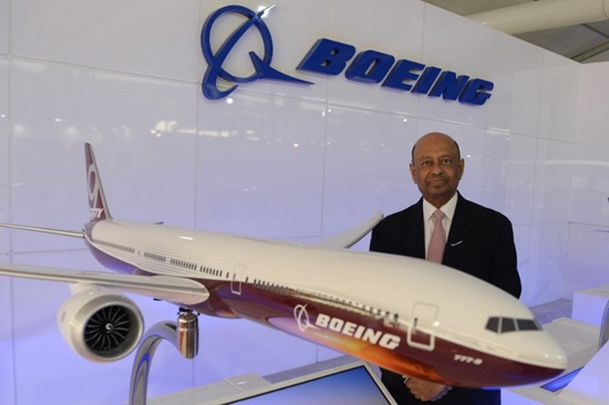 Dinesh Keskar, Senior Vice President, Asia Pacific and India Sales at Boeing Commercial Airplanes poses for a photo next to a replica model of the Boeing 777 at the Wings India 2018 at Begumpet airport in Hyderabad on March 8, 2018. Wings India 2018 is a Civil Aviation biennial event taking place at Begumpet airport in Hyderabad from 8th to 11th of March. Noah Seelam/AFP