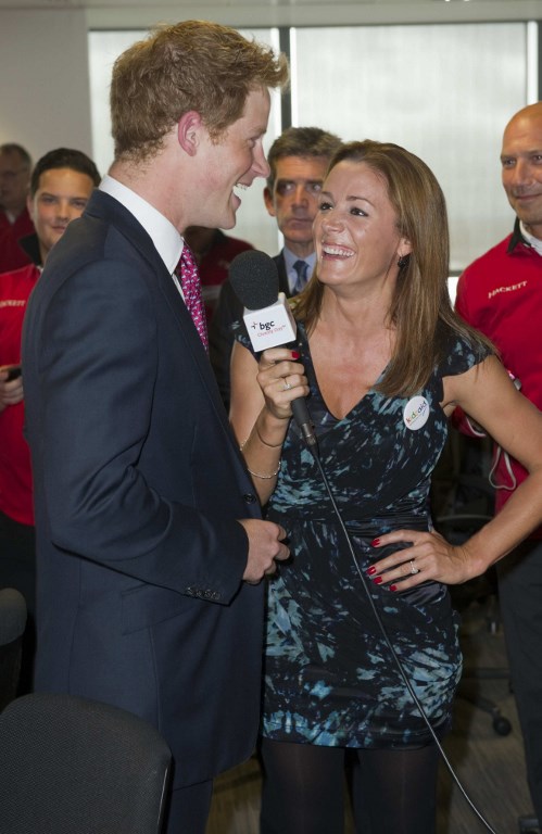 (FILES) In this file photo taken on September 12, 2011 Britains Prince Harry talks to British TV and radio presenter Natalie Pinkham on the trading floor as he attends BGC Partners Charity Day in London. Before he fell for American actress Meghan Markle, Britains Prince Harry, 33, had several other girlfriends. Paul Grover/Pool/AFP