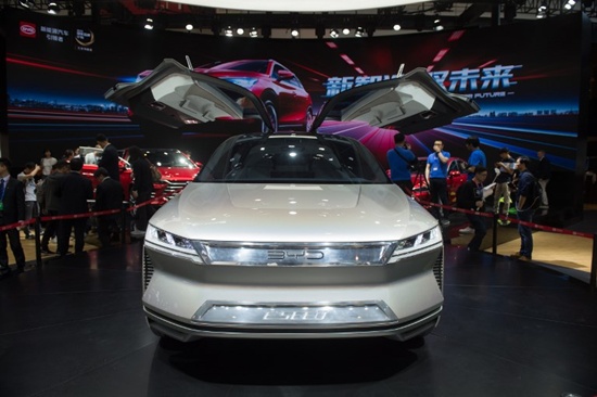 The BYD E-SEED concept car is viewed by visitors during the Beijing Auto Show in Beijing on April 25, 2018. Industry behemoths like Volkswagen, Daimler, Toyota, Nissan, Ford and others will display more than 1,000 models and dozens of concept cars at the Beijing auto show. Nicolas Asfour/AFP