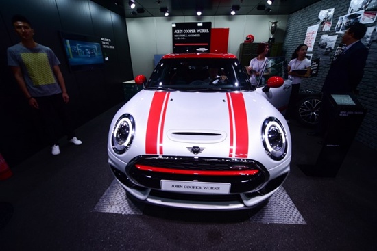 A BMW Mini Cooper is displayed at the Beijing auto show on April 25, 2018. Global carmakers touted their latest electric and SUV models in Beijing as they warily welcomed Chinas promise of better foreign access to the worlds largest auto market, where domestic vehicles are making major inroads. Industry behemoths like Volkswagen, Daimler, Toyota, Nissan, Ford and others are displaying more than 1,000 models and dozens of concept cars at the Beijing auto show. Wang Zhao/AFP