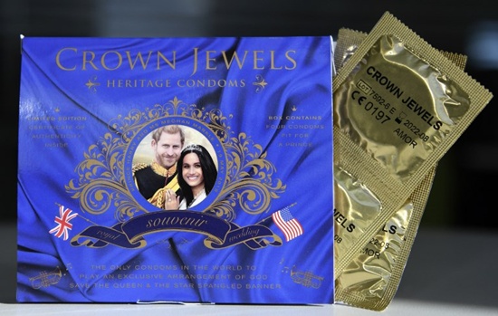 A picture arranged as an illustration shows a box of Crown Jewels condoms limited edition unofficial Royal Wedding souvenir box celebrating the upcoming nuptuals of Britains Prince Harry and his finacee US actress Meghan Markle, photographed in London on May 10, 2018. Prince Harry will marry US actress Meghan Markle on May 19 in a ceremony at Windsor Castle. The Crown Jewels of London unofficial royal wedding souvenir four-pack comes in a box that when opened reveals a pop-up portrait representation of Harry and Maghan and plays a combined arrangment of the US and British national anthems accompanied by the legend Your prince will come. Daniel Sorabji/AFP