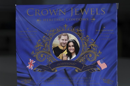 A picture arranged as an illustration shows a box of Crown Jewels condoms limited edition unofficial Royal Wedding souvenir box celebrating the upcoming nuptuals of Britains Prince Harry and his finacee US actress Meghan Markle, photographed in London on May 10, 2018. Prince Harry will marry US actress Meghan Markle on May 19 in a ceremony at Windsor Castle. The Crown Jewels of London unofficial royal wedding souvenir four-pack comes in a box that when opened reveals a pop-up portrait representation of Harry and Maghan and plays a combined arrangment of the US and British national anthems accompanied by the legend Your prince will come. Daniel Sorabji/AFP