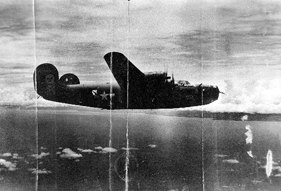 This circa 1943 U.S. Army Air Force photo from the Kelly Family Research Project shows the Heaven Can Wait B-24 bomber, location unknown, in which Lt. Thomas Kelly died when it was shot down in Hansa Bay in what is now Papua New Guinea during World War II. (U.S. Army Air Force/Kelly Family Research Project via AP)