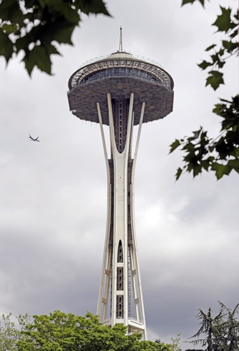 In this photo taken May 20, 2018, a floor scaffolding remains below the upper portion of the Space Needle as it stands above the grounds of the Seattle Center in Seattle. (AP Photo/Elaine Thompson)