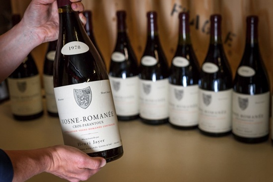 A picture taken on April 27, 2018 in Geneva shows magnums (1.5 litre bottle) of Vosne-Romanee 1er cru Cros Parantoux wine by late famous French winemaker Henri Jayer. The final bottles of late legendary winemaker Henri Jayers Burgundies -- including some of the worlds most expensive wines -- will go on auction in Geneva next month and could rake in up to $13 million. Fabrice Coffrini/AFP