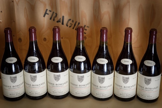 A picture taken on April 27, 2018 in Geneva shows magnums (1.5 litre bottle) of Vosne-Romanee 1er cru Cros Parantoux wine by late famous French winemaker Henri Jayer. The final bottles of late legendary winemaker Henri Jayers Burgundies -- including some of the worlds most expensive wines -- will go on auction in Geneva next month and could rake in up to $13 million. Fabrice Coffrini/AFP