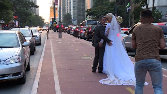 Husband and wife Ademir Avelino, 52, and Glaucia Sudan, 45, pose in wedding clothes for pictures in Sao Paulo on June 8, 2018. The Brazilian couple have the unusual hobby of travelling around the world pretending theyve just got hitched again. After posing in full wedding garb from Europe to the Middle East and Australia, they returned to do it all over in their native city just ahead of Brazils version of Valentines Day on Tuesday. Johannes Myburgh/AFPTV/AFP