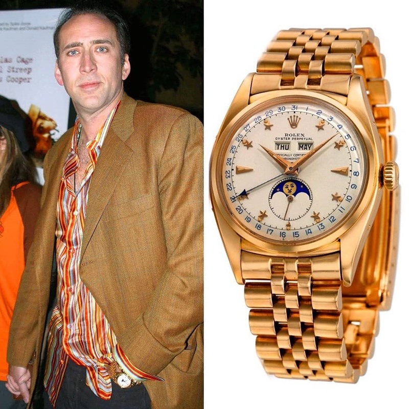 นักแสดงรุ่นเก๋าอย่าง Nicolas Cage ก็ต้องสวมอะไรเก๋าๆ อย่าง Rolex Moonphase 6062 สี Rose Gold 18k ซึ่งจัดได้ว่าเป็นประติมากรรมแห่งเครื่องบอกว่าเวลาเลยก็ว่าได้ โดยรุ่นนี้กำเนิดขึ้นในปี 1950 เป็นนาฬิกาเก่าที่นักสะสมสายลึกต้องครอบครองให้ได้ ราคาเริ่มต้น 650,000 $ หรือราว 20.4 ล้านบาท 