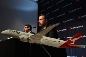 Qantas flags lower interim earnings
